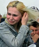 Romanian woman crying over flood